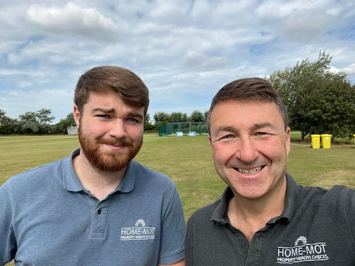 Simon and his son at a cricket club for a property inspection